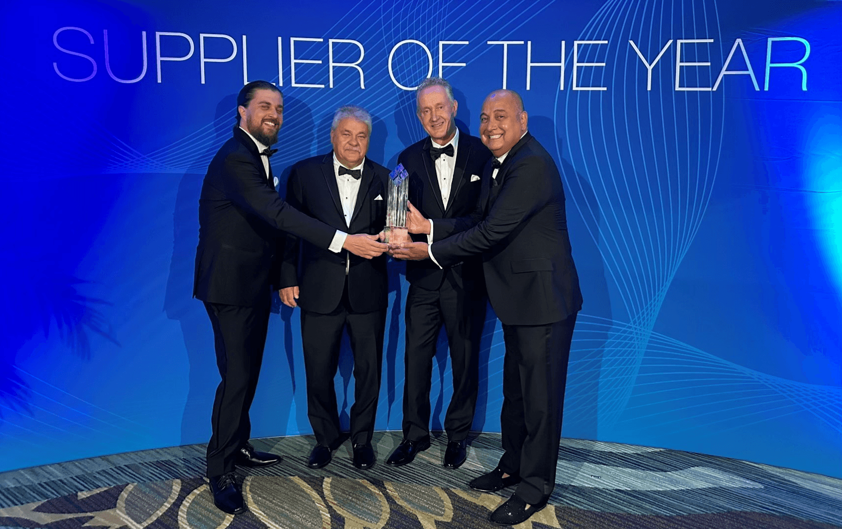 Management of Harper Engineering Co. receiving Supplier of the Year award at Boeing`s annual event.