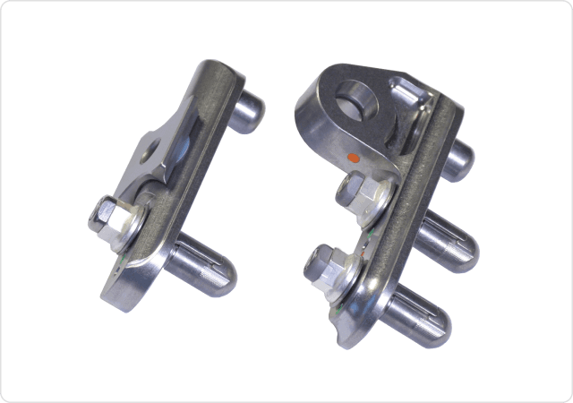 Both sides of seat track fittings designed and manufactured by Harper Engineering Co.